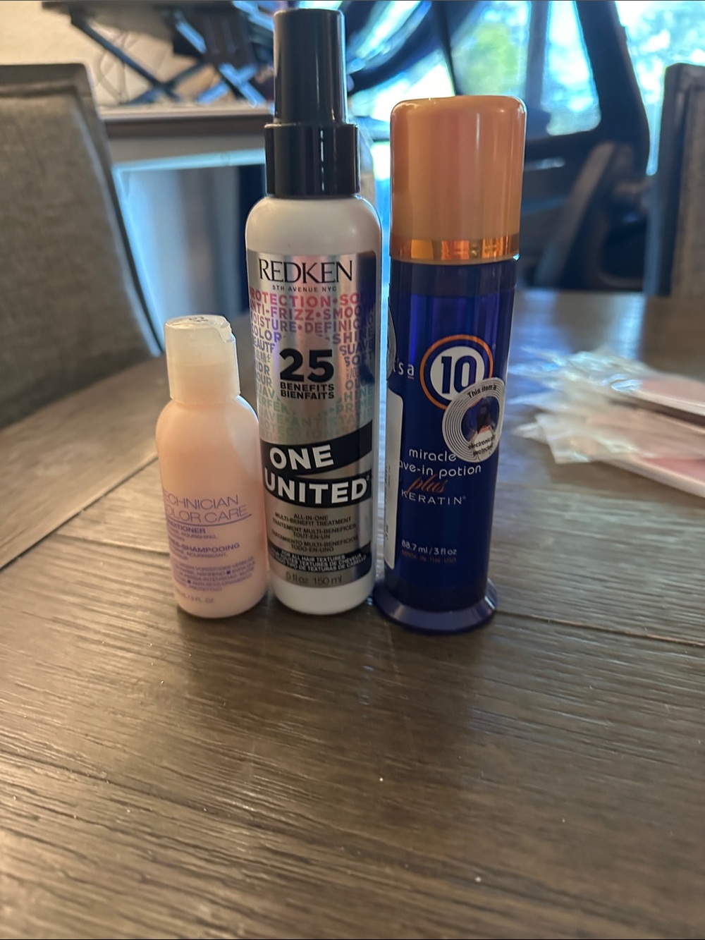 Redken One United Leave-In Treatment Spray White Bottle with Black Cap
